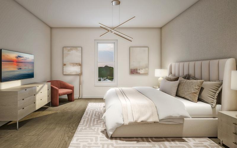 a bedroom with a bed and a chair
