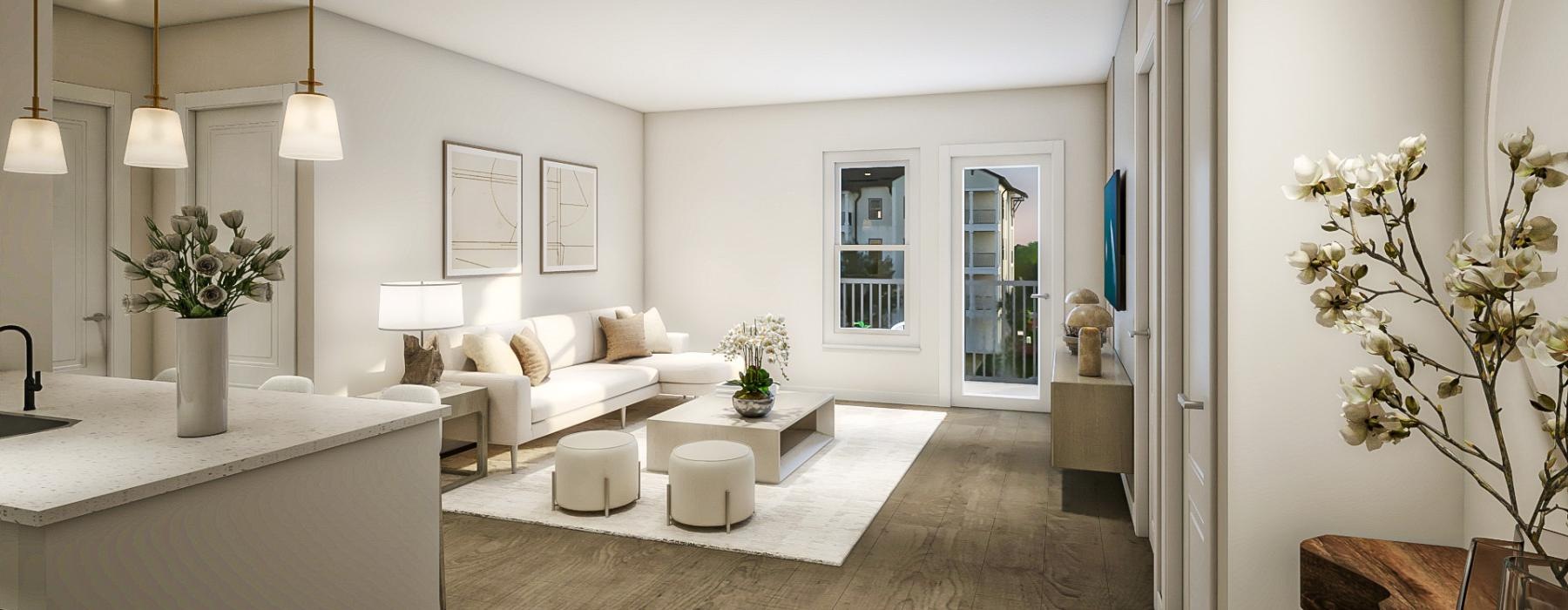 a living room with a white couch and a white table