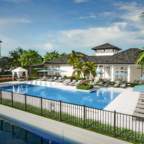 a swimming pool with a fence around it and buildings around it
